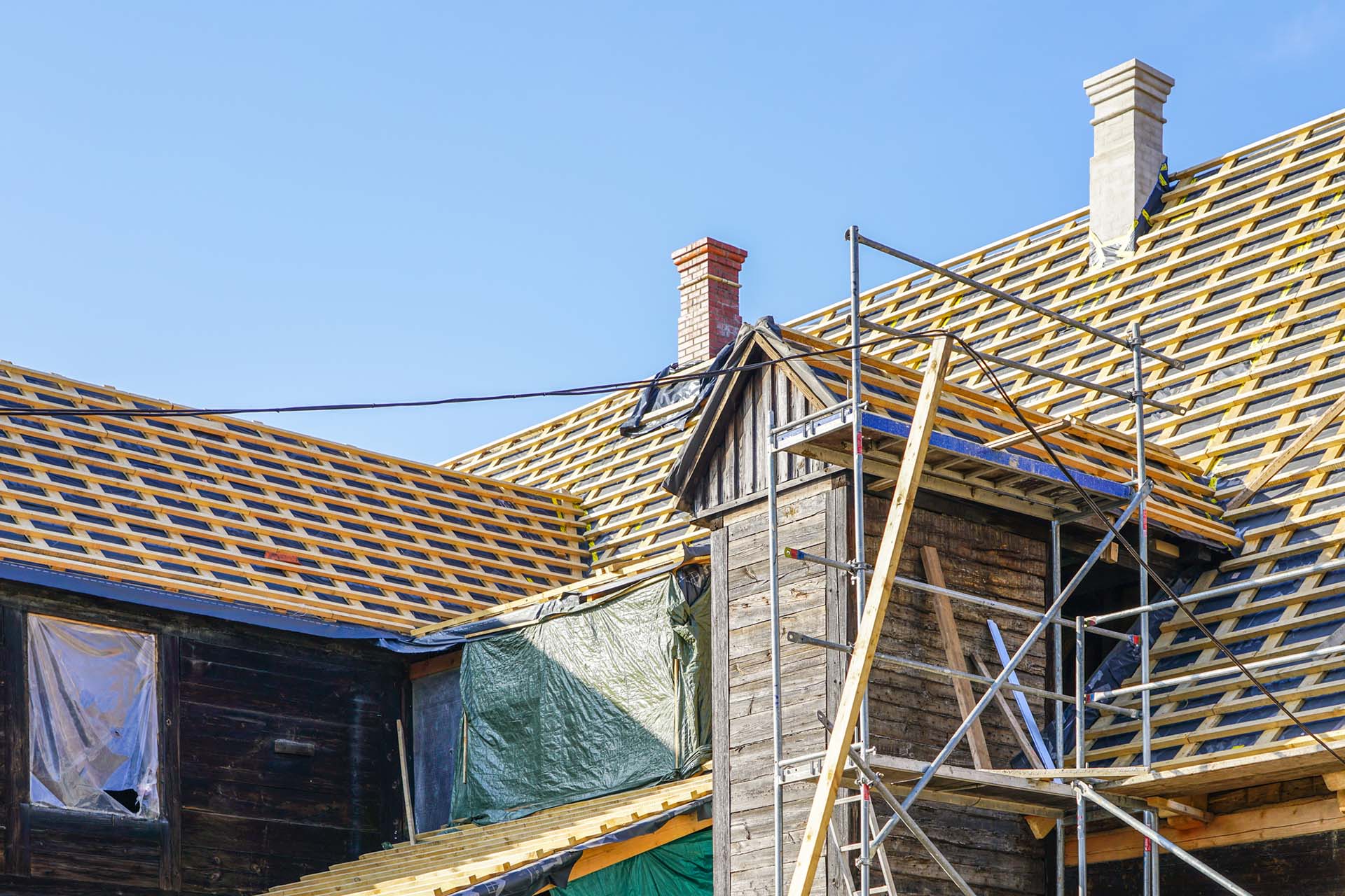 repair of the roof structures of a beautiful historic wooden house and replacement of clay tiles