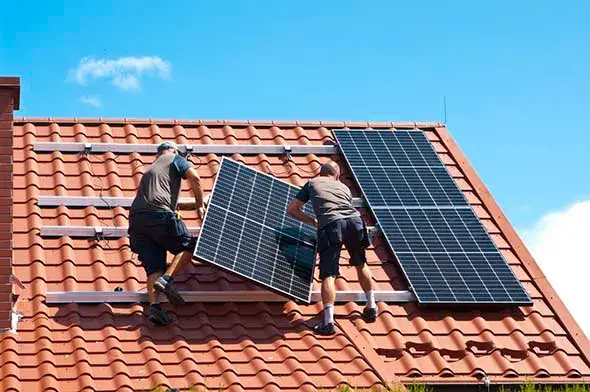 installing new solar panels on the roof of a private house